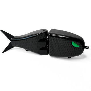 Black Maxed Fishing Raptor glide bait with green eye and textured scale pattern.