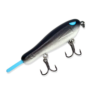 Black and white bfs topwater lure with blue eye and tail.