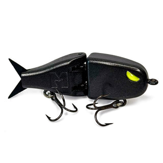A metallic or glitter black BFS glide bait with a bright yellow-green eye and two treble hooks, shown on a plain white background.