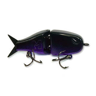 A BFS jointed glide bair with a black and purple gradient body, featuring a large embossed letter 'M' on the side, two treble hooks, and a white background.