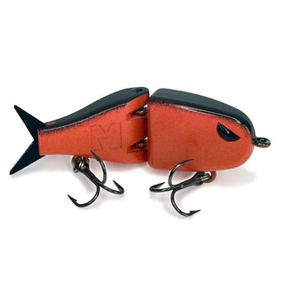 Red peach color body BFS glide bait with a black back, tail, eye, and treble hooks.