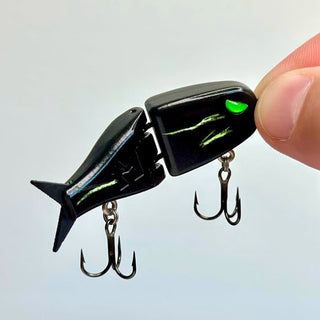 Scratched Alien Raptor black BFS glide bait revealing bright green underneath