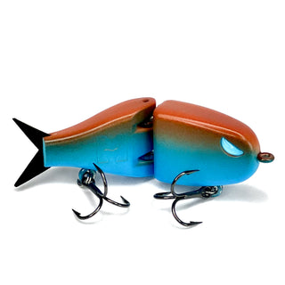 Maxed Fishing Raptor BFS glide bait in blue and orange with black tail, blue eye, and treble hooks.