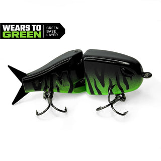 A two-piece BFS fishing lure with a black and green gradient design, featuring two treble hooks and a 'WEARS TO GREEN' badge overlay in the top left corner.